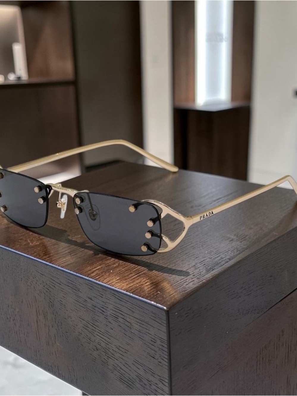 Prada Gold Frame Black Lens Rimless Women’s Sunglasses
